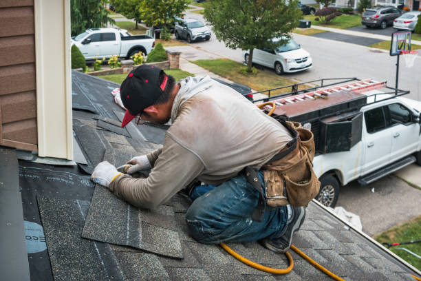 Professional Roofing technician working in Cummings, ND